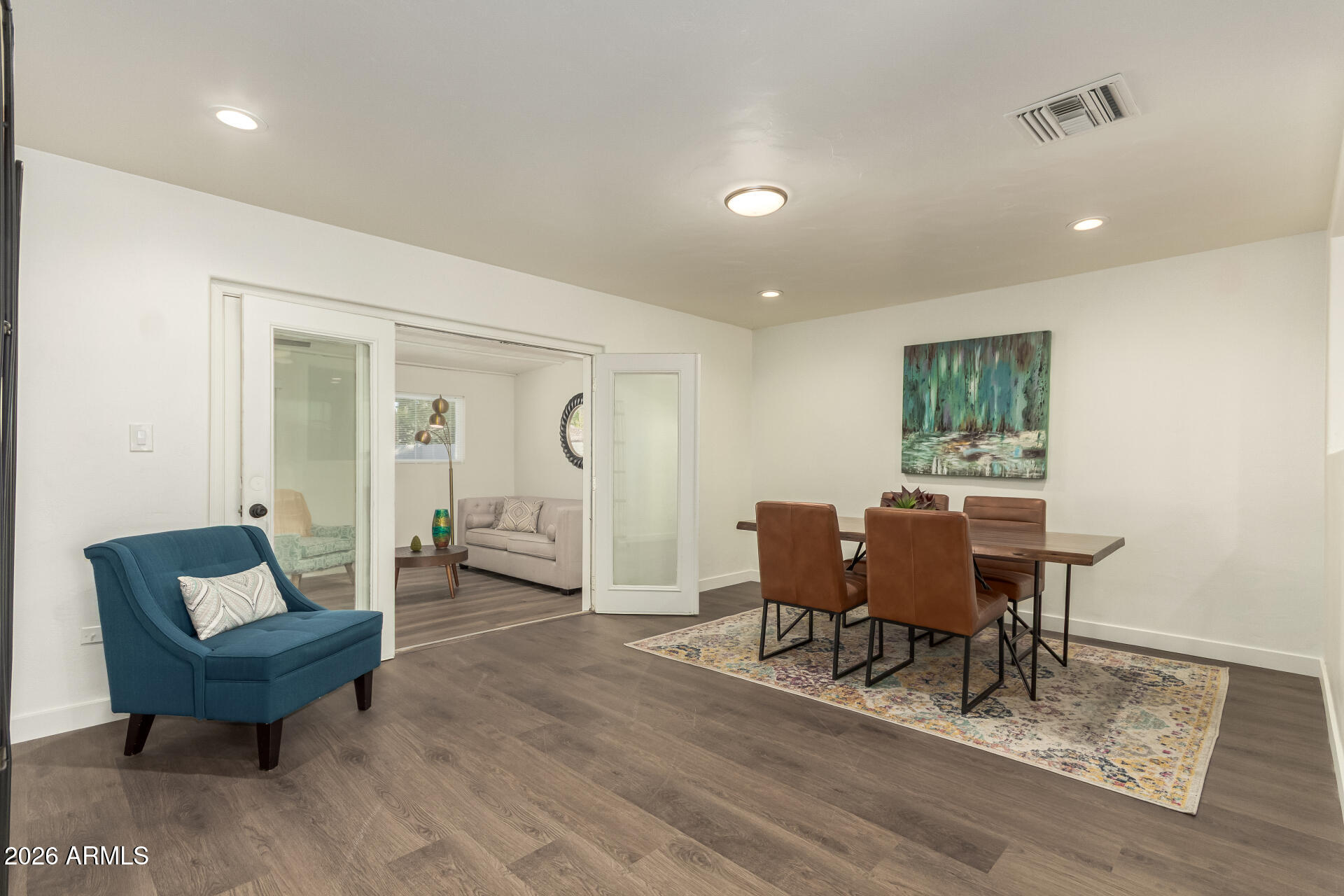 7819 North 17th Avenue Phoenix, AZ 85021 - Photo 1 of 31 a living room with furniture and a wooden floor