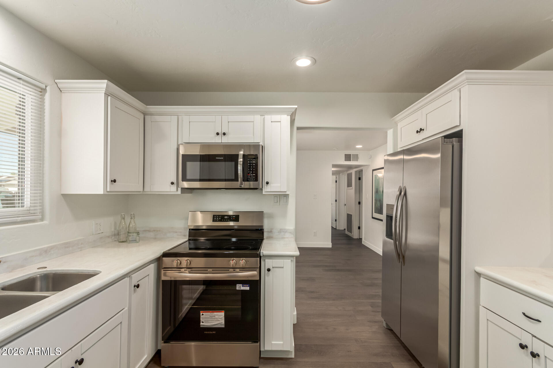 7819 North 17th Avenue Phoenix, AZ 85021 - Photo 11 of 31 a kitchen with a refrigerator stove and sink