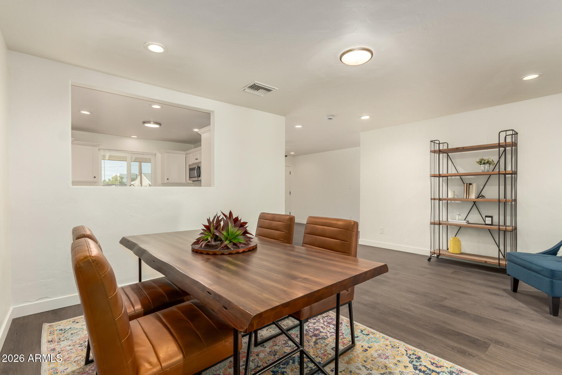 7819 North 17th Avenue Phoenix, AZ 85021 - Photo 13 of 31 a view of a dining room with furniture and wooden floor