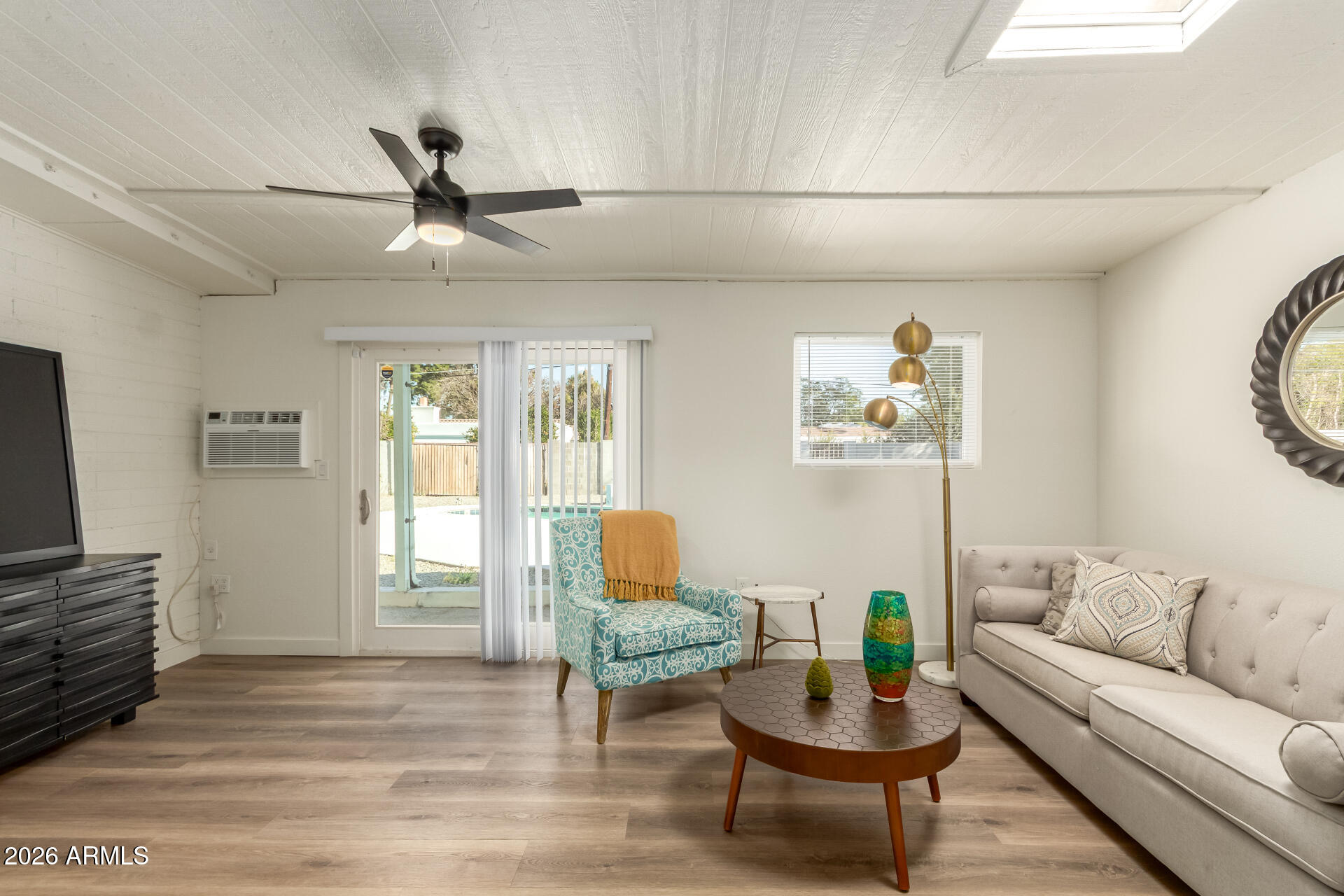 7819 North 17th Avenue Phoenix, AZ 85021 - Photo 16 of 31 a living room with furniture and a wooden floor