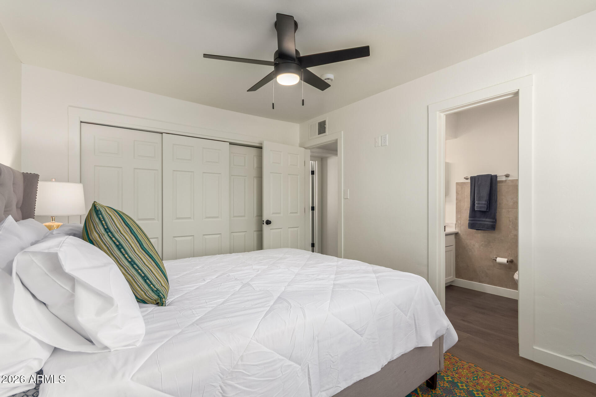 7819 North 17th Avenue Phoenix, AZ 85021 - Photo 18 of 31 a bedroom with a bed and a chandelier