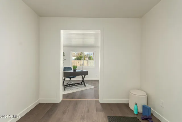 a living room with a toilet and a window