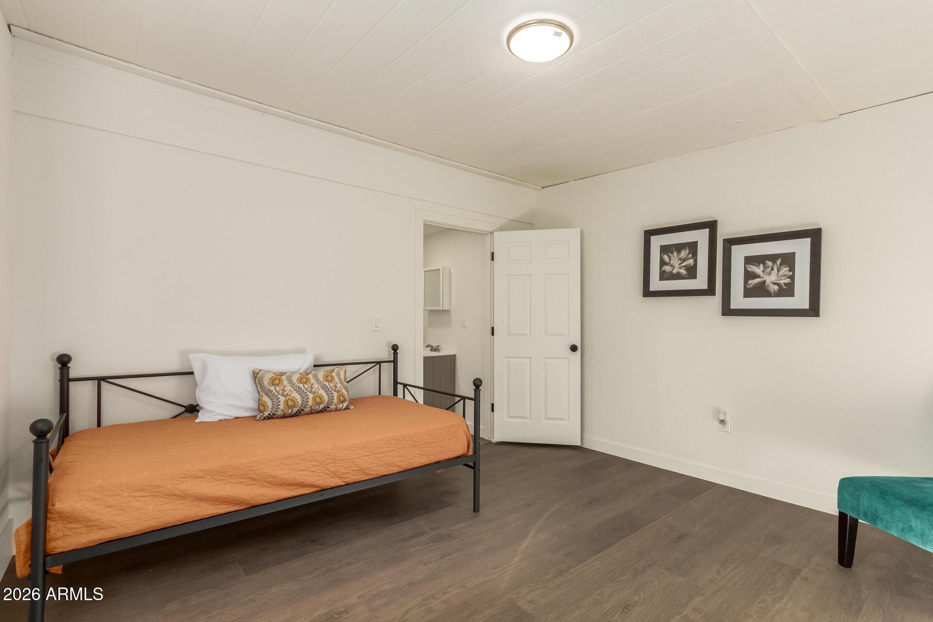 7819 North 17th Avenue Phoenix, AZ 85021 - Photo 28 of 31 a bedroom with a bed and a cabinets