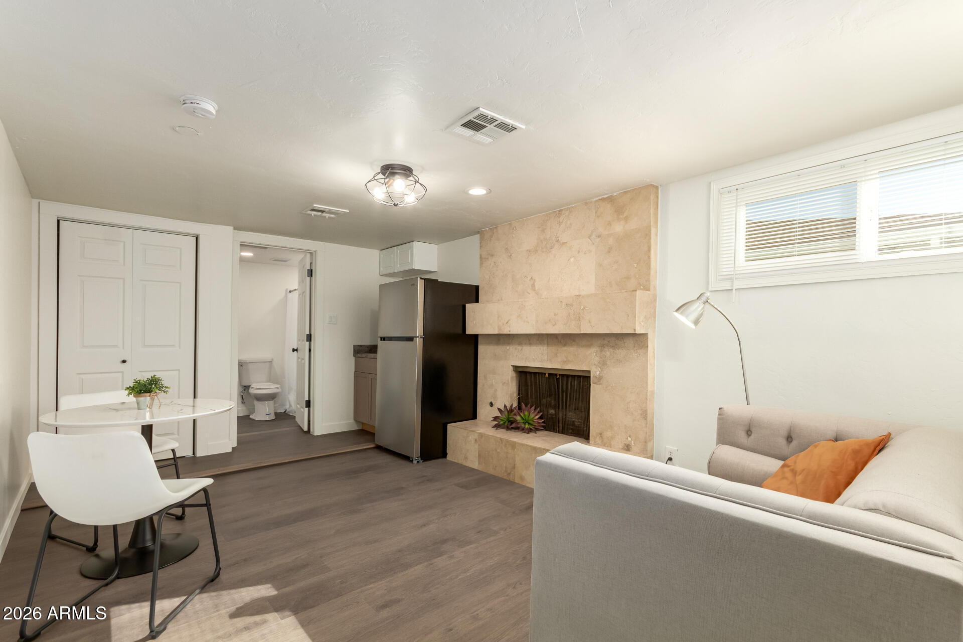 7819 North 17th Avenue Phoenix, AZ 85021 - Photo 4 of 31 a living room with furniture and a fireplace