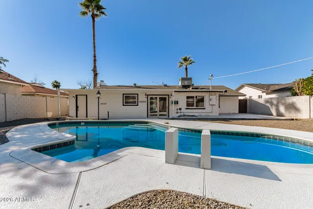a kitchen with stainless steel appliances kitchen island granite countertop a sink and cabinets