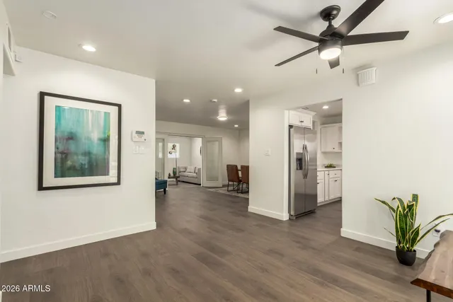 a view of a livingroom with furniture and a potted plant