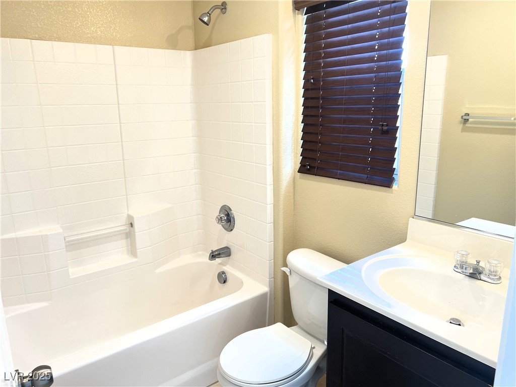 9535 Leaping Lizard Street Las Vegas, NV 89178 - Photo 20 of 37 Full bath on first floor with vanity, bathtub / shower combination, and toilet