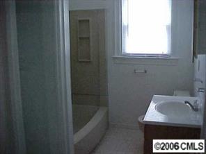 3716 Tuckaseegee Road, Unit A&B Charlotte, NC 28208 - Photo 4 of 8 a bathroom with a sink and a bathtub