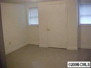 3716 Tuckaseegee Road, Unit A&B Charlotte, NC 28208 - Photo 8 of 8 an empty room with a window