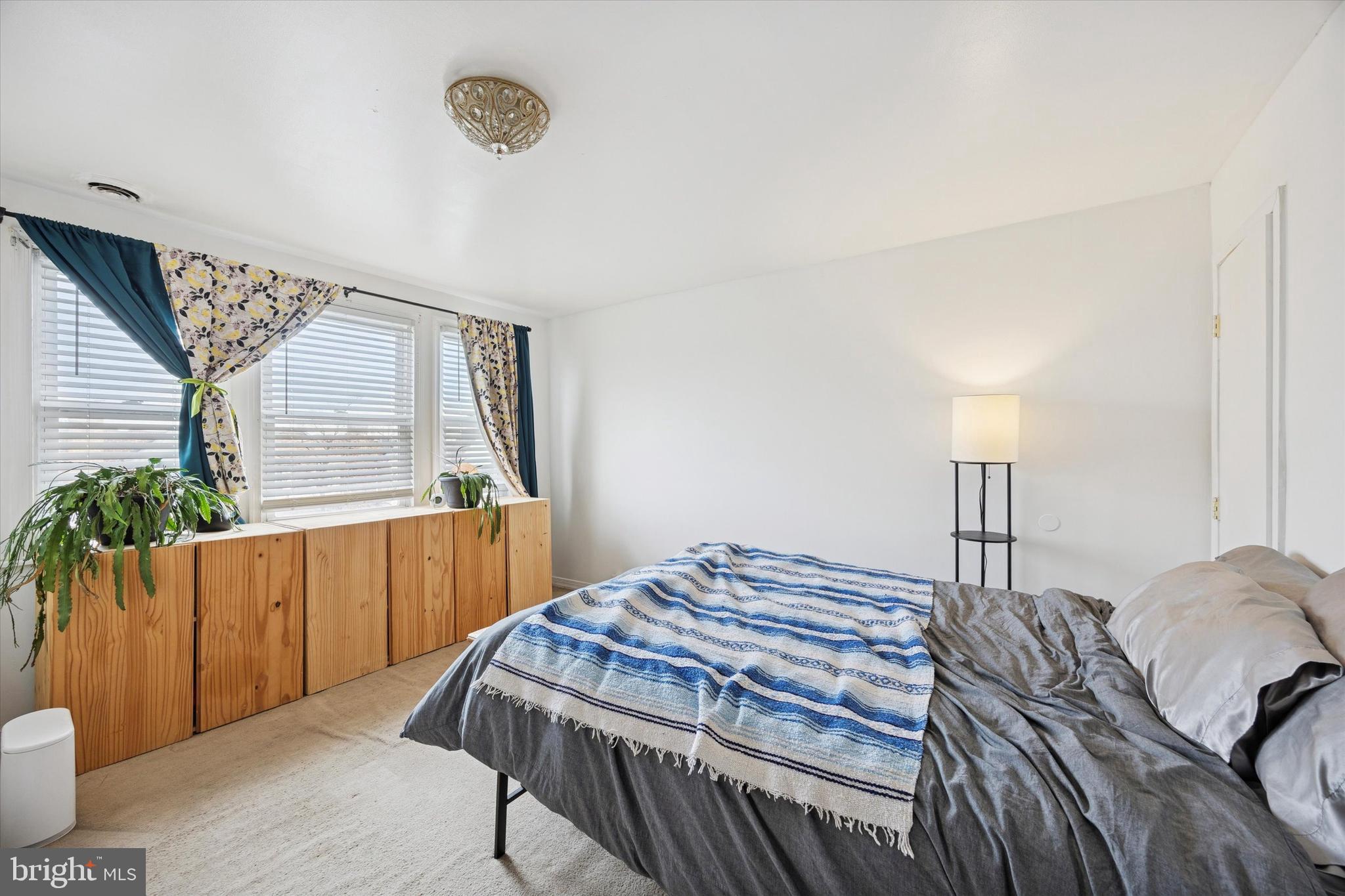 5624 North Warnock Street Philadelphia, PA 19141 - Photo 11 of 15 a bedroom with a bed and a window