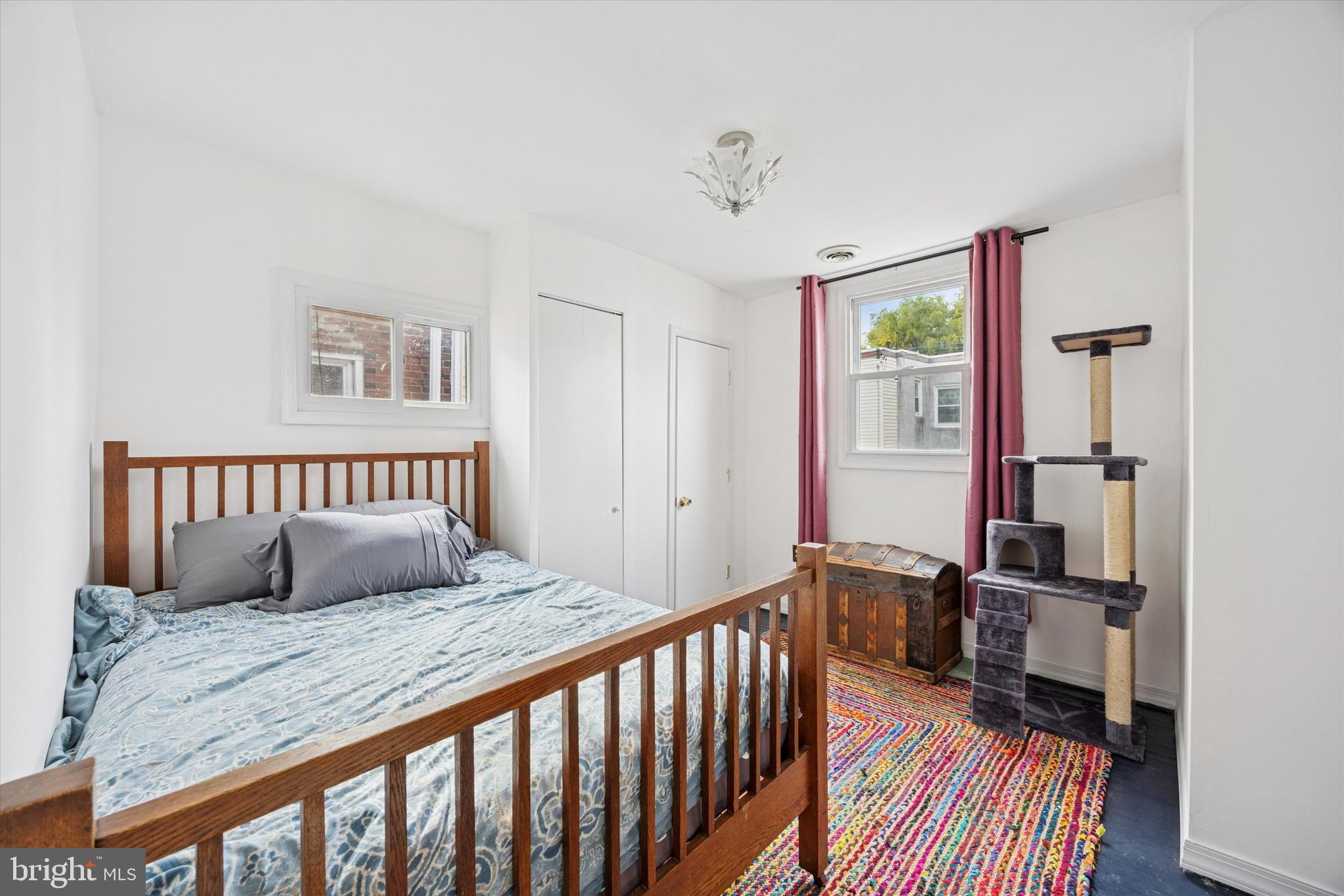 5624 North Warnock Street Philadelphia, PA 19141 - Photo 12 of 15 a bedroom with a bed and a window