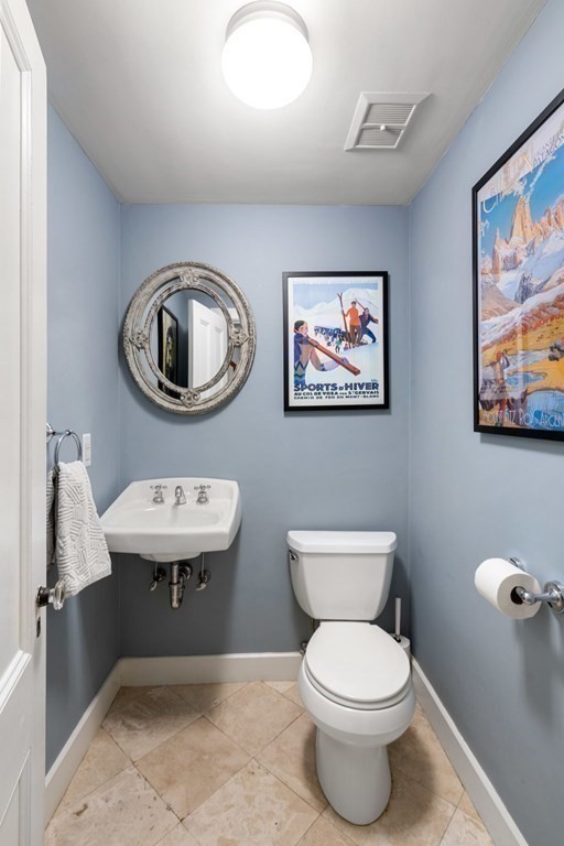 12 Cedar Street Boston, MA 02129 - Photo 12 of 23 a bathroom with a toilet a sink and mirror