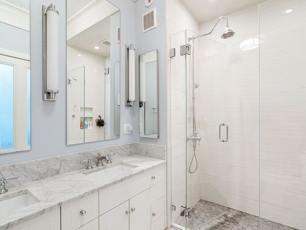 12 Cedar Street Boston, MA 02129 - Photo 17 of 23 a bathroom with a granite countertop sink mirror and shower