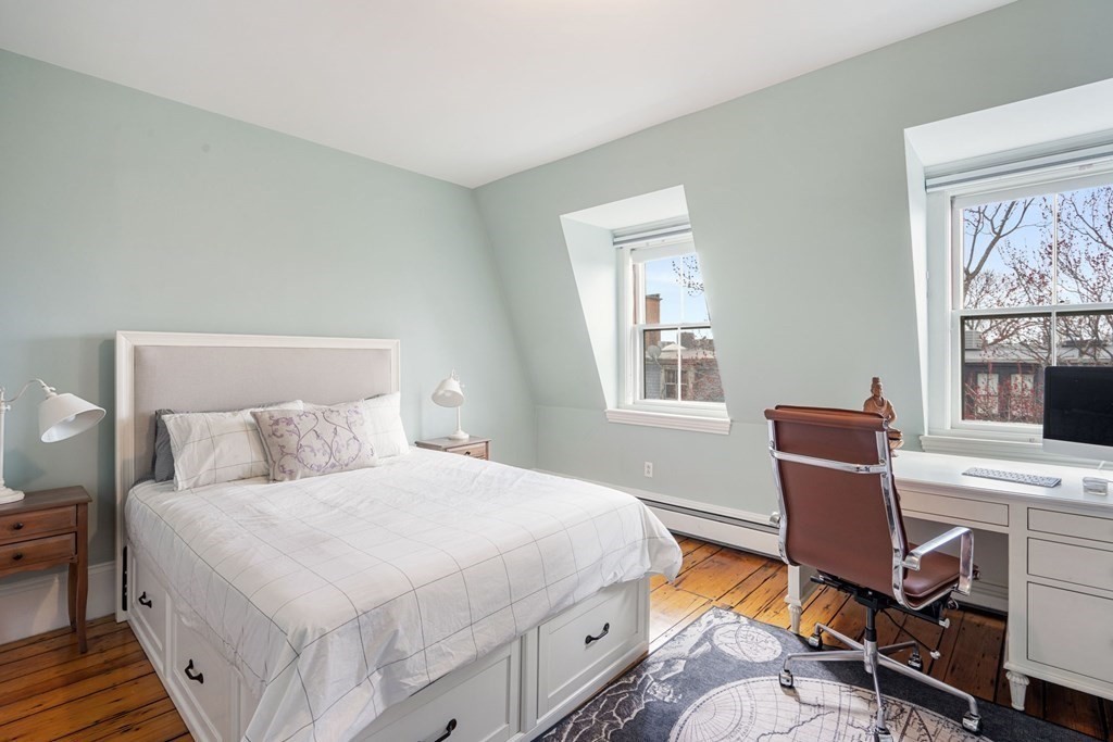 12 Cedar Street Boston, MA 02129 - Photo 19 of 23 a bedroom with a bed and wooden floor