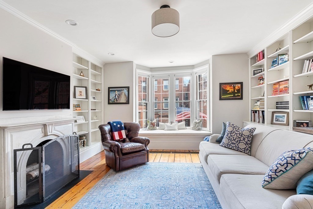 12 Cedar Street Boston, MA 02129 - Photo 2 of 23 a living room with fireplace furniture and a flat screen tv