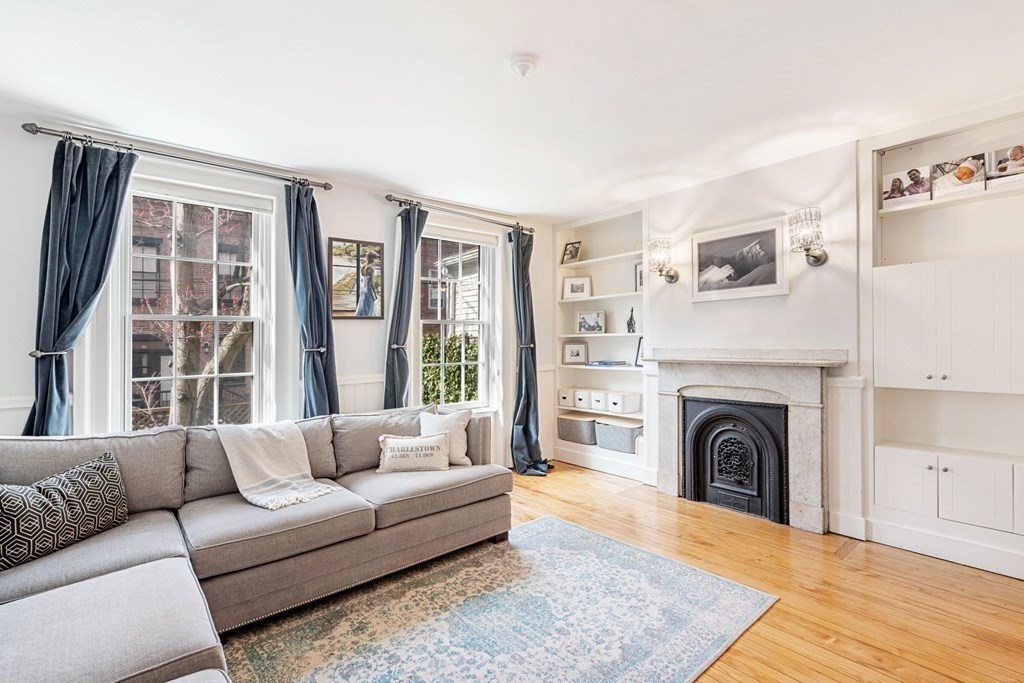 12 Cedar Street Boston, MA 02129 - Photo 4 of 23 a living room with furniture and a fireplace