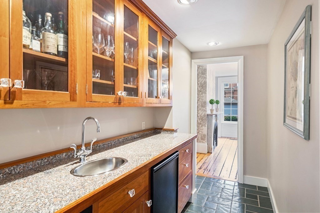 12 Cedar Street Boston, MA 02129 - Photo 5 of 23 a kitchen with granite countertop a sink and dishwasher in it