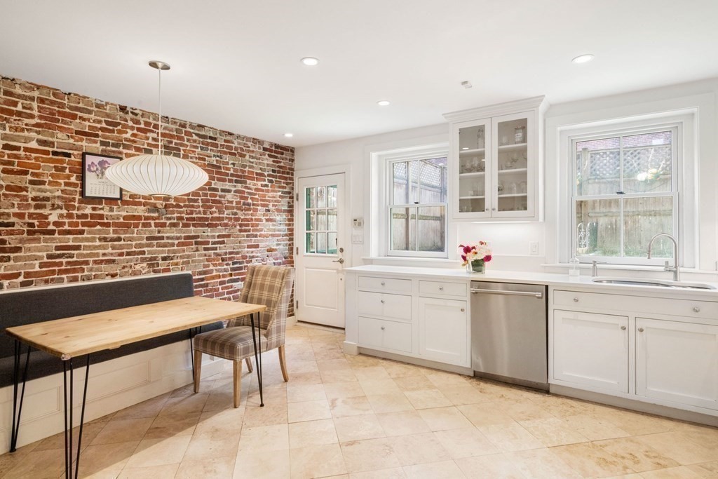 12 Cedar Street Boston, MA 02129 - Photo 7 of 23 a kitchen with sink cabinets and window