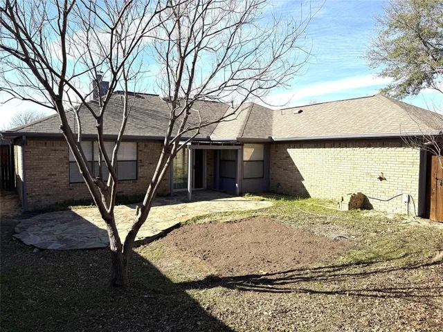 a house with trees in front of it