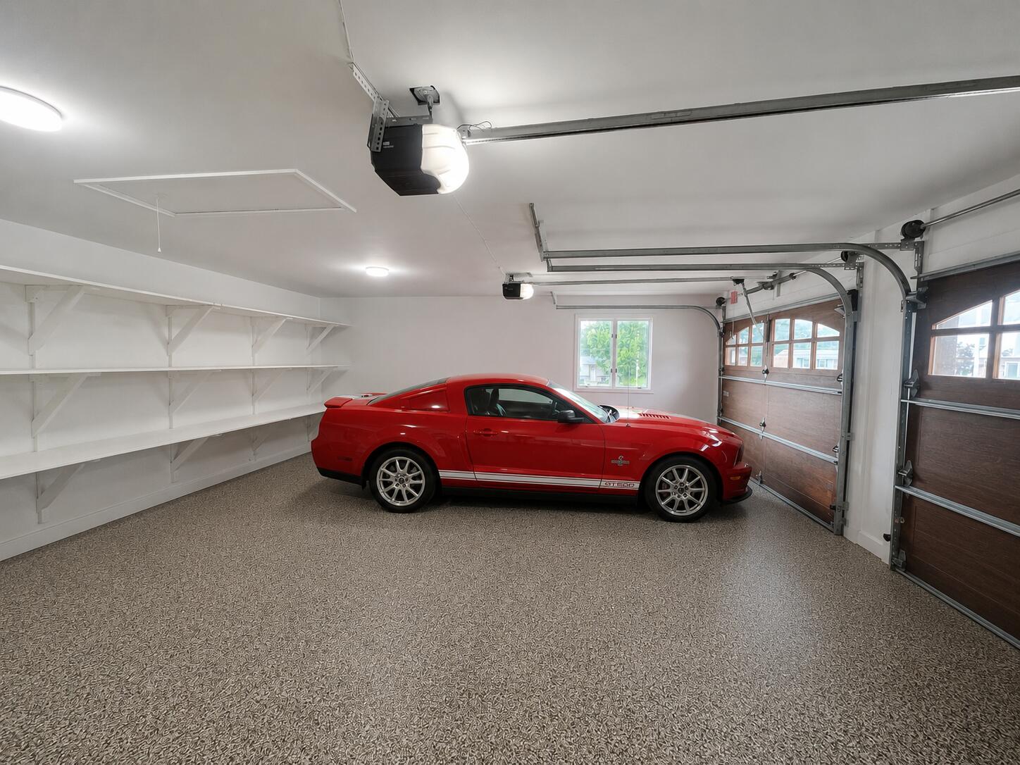 2612 Amsterdam Road Villa Hills, KY 41017 - Photo 23 of 52 ATTACHED 2 CAR GARAGE FEATURING SHELVING, RECESSED LIGHTING, CUSTOM OPOXY DURABLE FLOORING, AND PLEANTY OF STORAGE