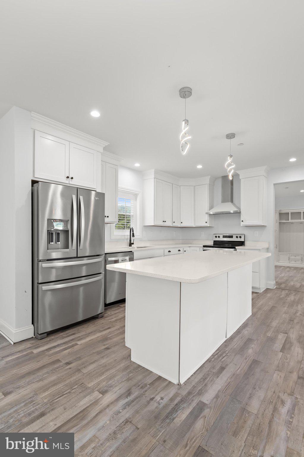 7832 Old Receiver Road Frederick, MD 21702 - Photo 13 of 57 a kitchen with stainless steel appliances a refrigerator sink and cabinets