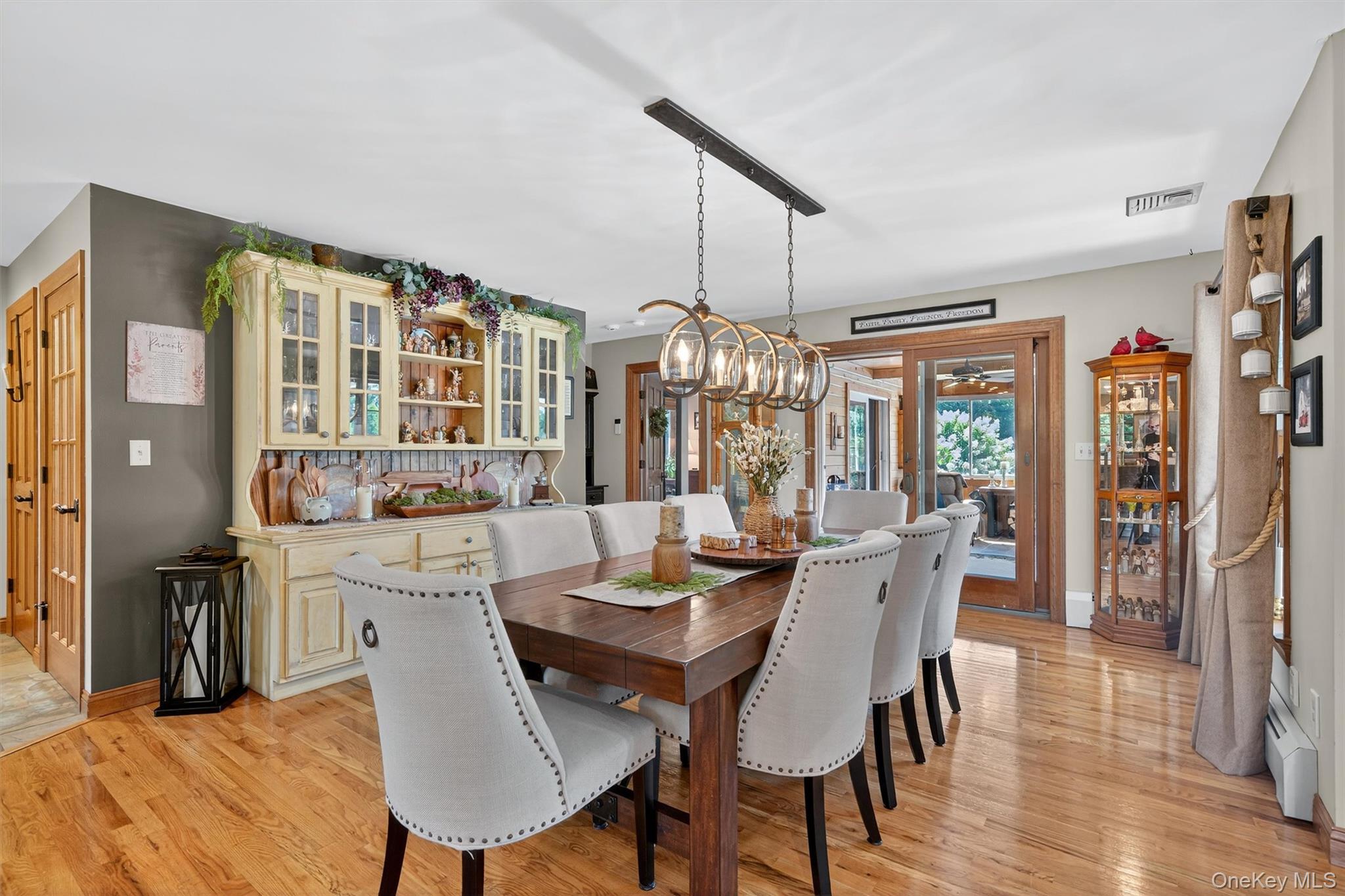 91 Distillery Road Warwick, NY 10990 - Photo 13 of 49 a view of a dining room with furniture window and wooden floor
