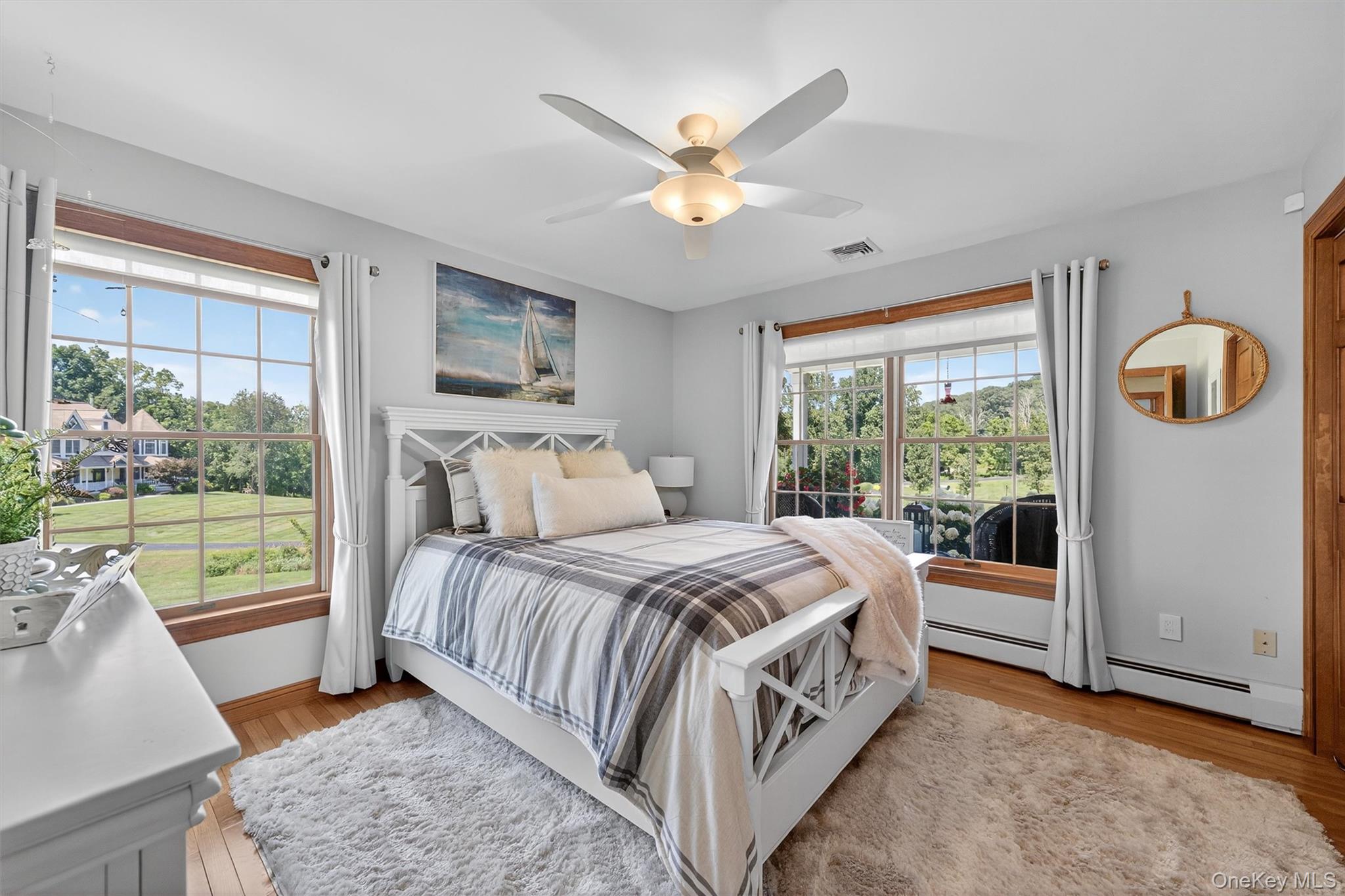 91 Distillery Road Warwick, NY 10990 - Photo 21 of 49 a bedroom with a bed and a large window