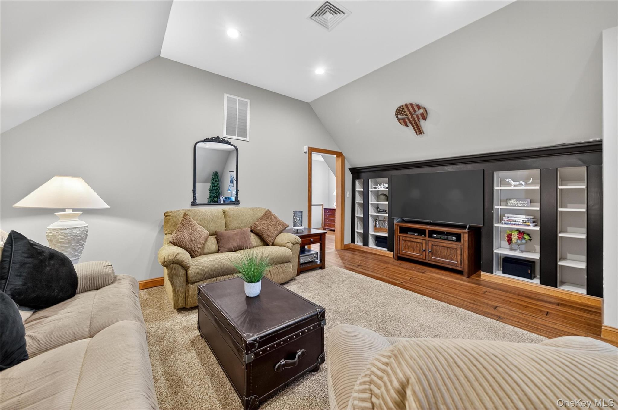 91 Distillery Road Warwick, NY 10990 - Photo 24 of 49 a living room with furniture a flat screen tv and a large window