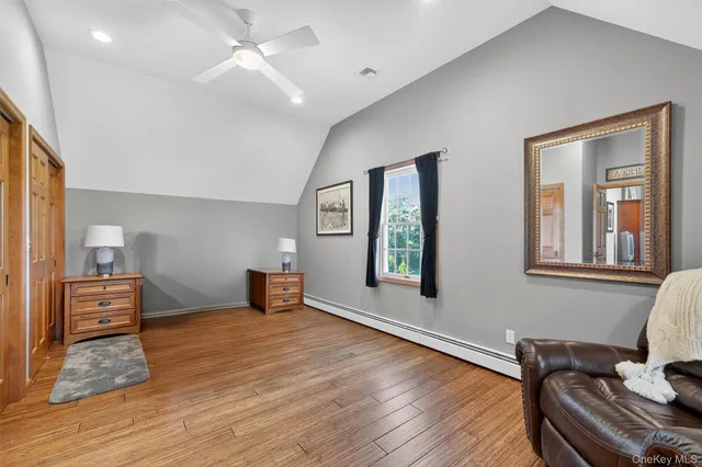 a bedroom with furniture and window
