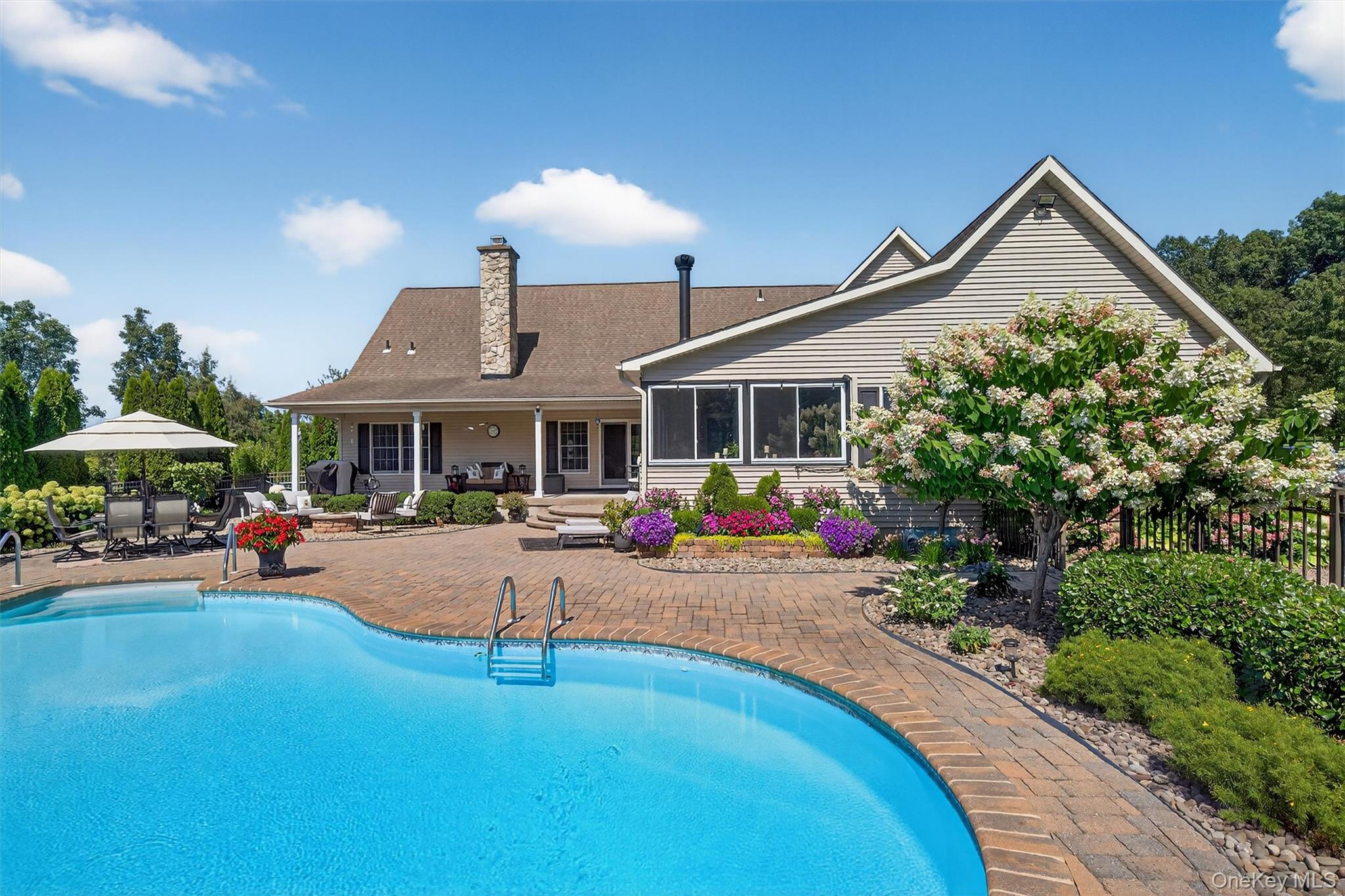 91 Distillery Road Warwick, NY 10990 - Photo 33 of 49 a view of a house with swimming pool and sitting area