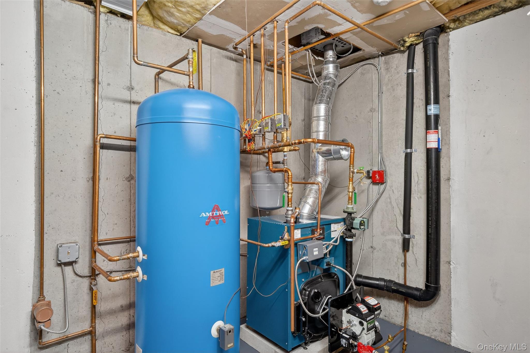 91 Distillery Road Warwick, NY 10990 - Photo 41 of 49 a view of storage and utility room with racks on the wall