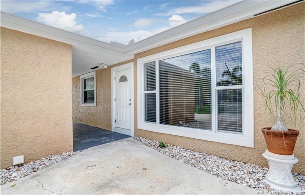 820 Northwest 10th Terrace Stuart, FL 34994 - Photo 20 of 21 a view of a door and a window