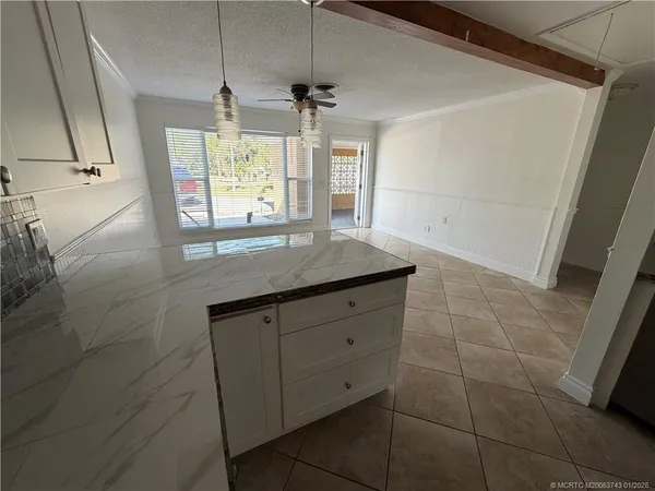 a bathroom with a granite countertop sink a large mirror and a shower