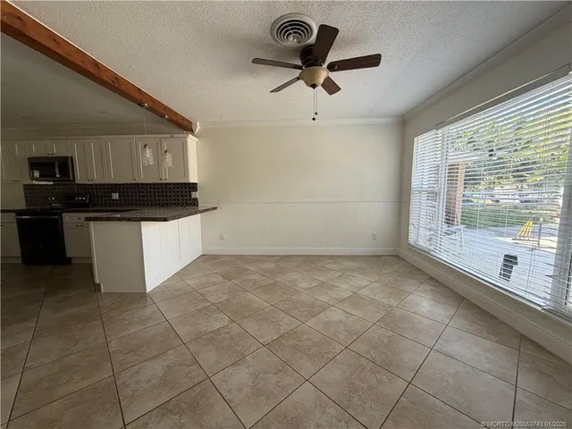 a kitchen with stainless steel appliances granite countertop a sink and a stove