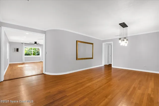 a view of livingroom with hardwood floor and a ceiling fan