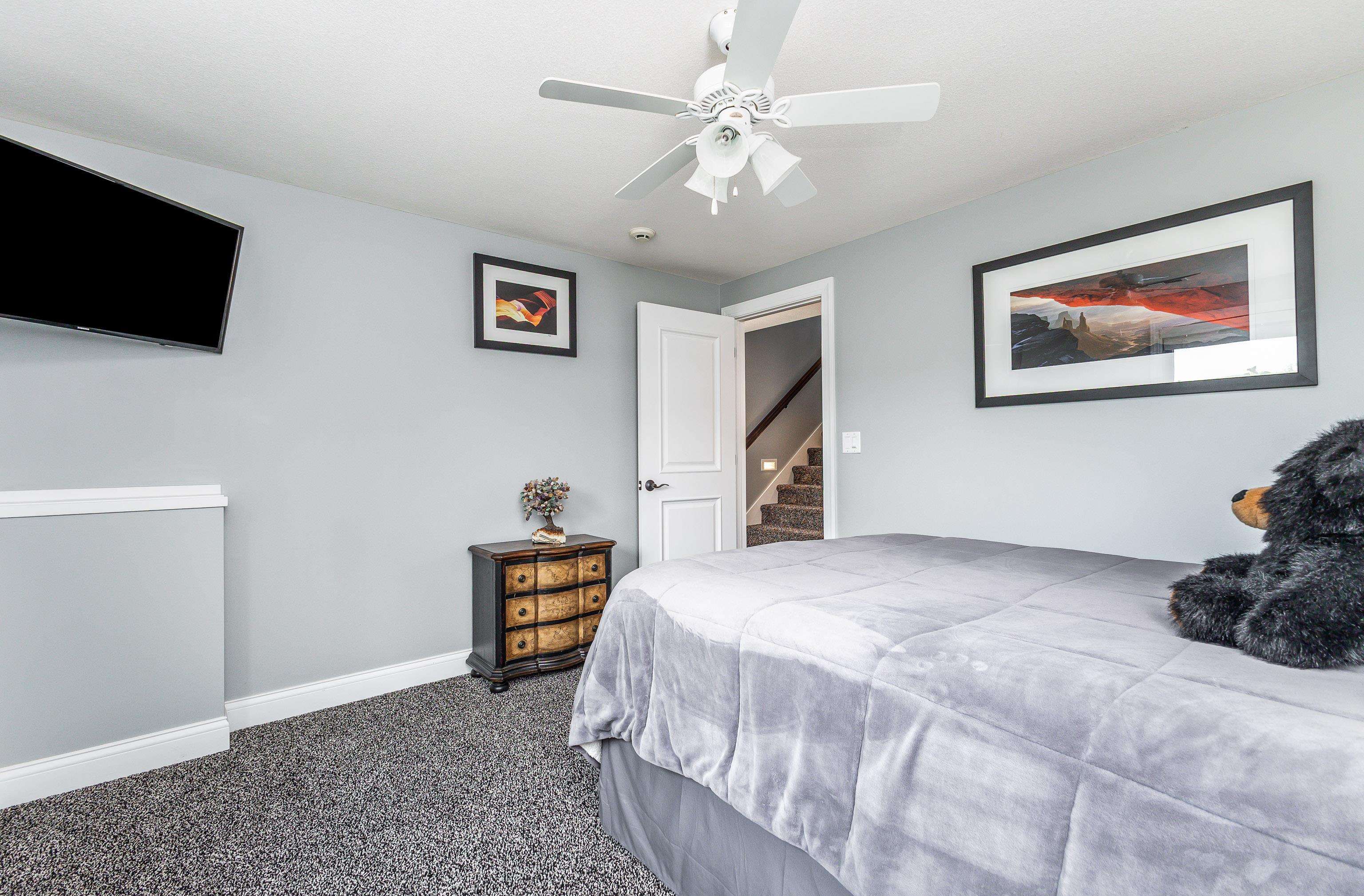 6 Hickory Trail Galena, IL 61036 - Photo 45 of 67 a bedroom with a bed and a flat screen tv