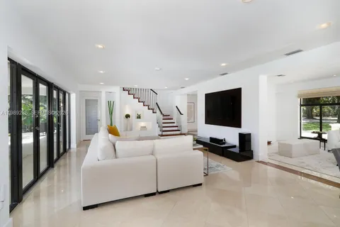 a kitchen with stainless steel appliances kitchen island granite countertop a sink and cabinets