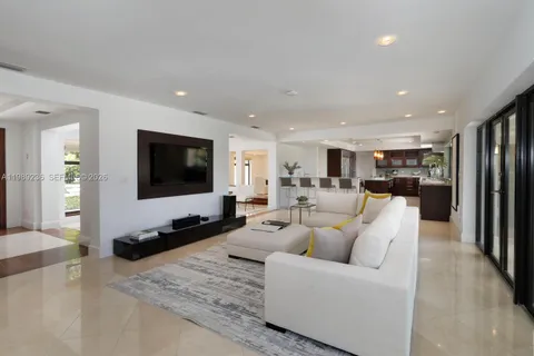 a kitchen with stainless steel appliances kitchen island granite countertop a sink and cabinets