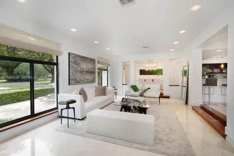 a living room with furniture and a table