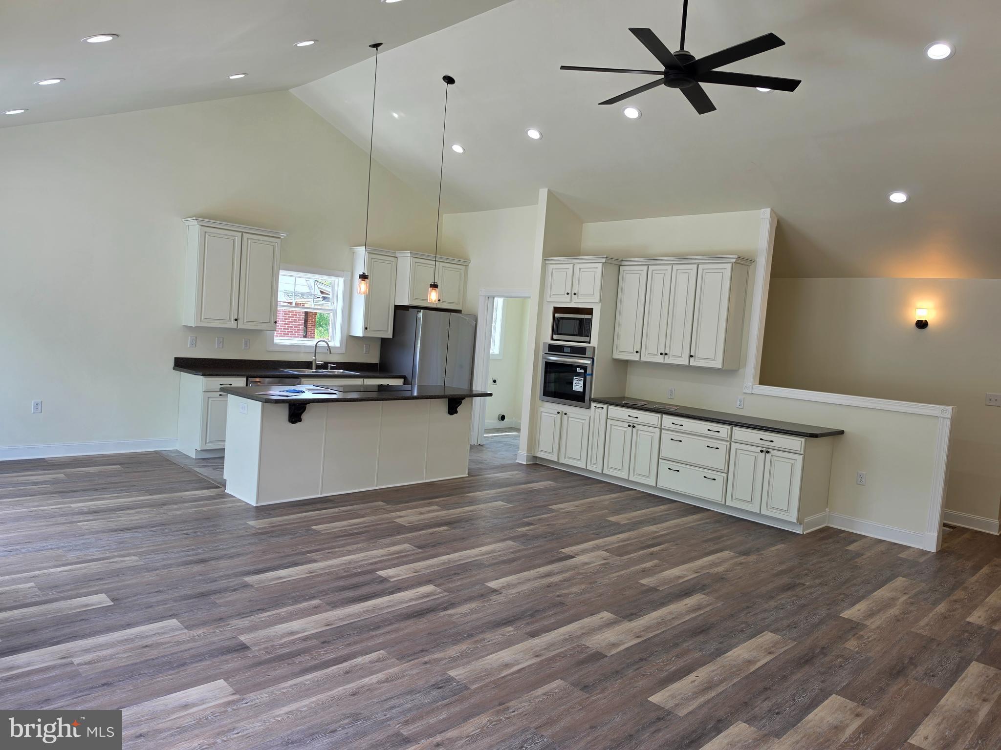 13514 Old Cresaptown Road Southwest Lavale, MD 21502 - Photo 6 of 25 a kitchen with stainless steel appliances granite countertop a stove top oven a sink and a refrigerator