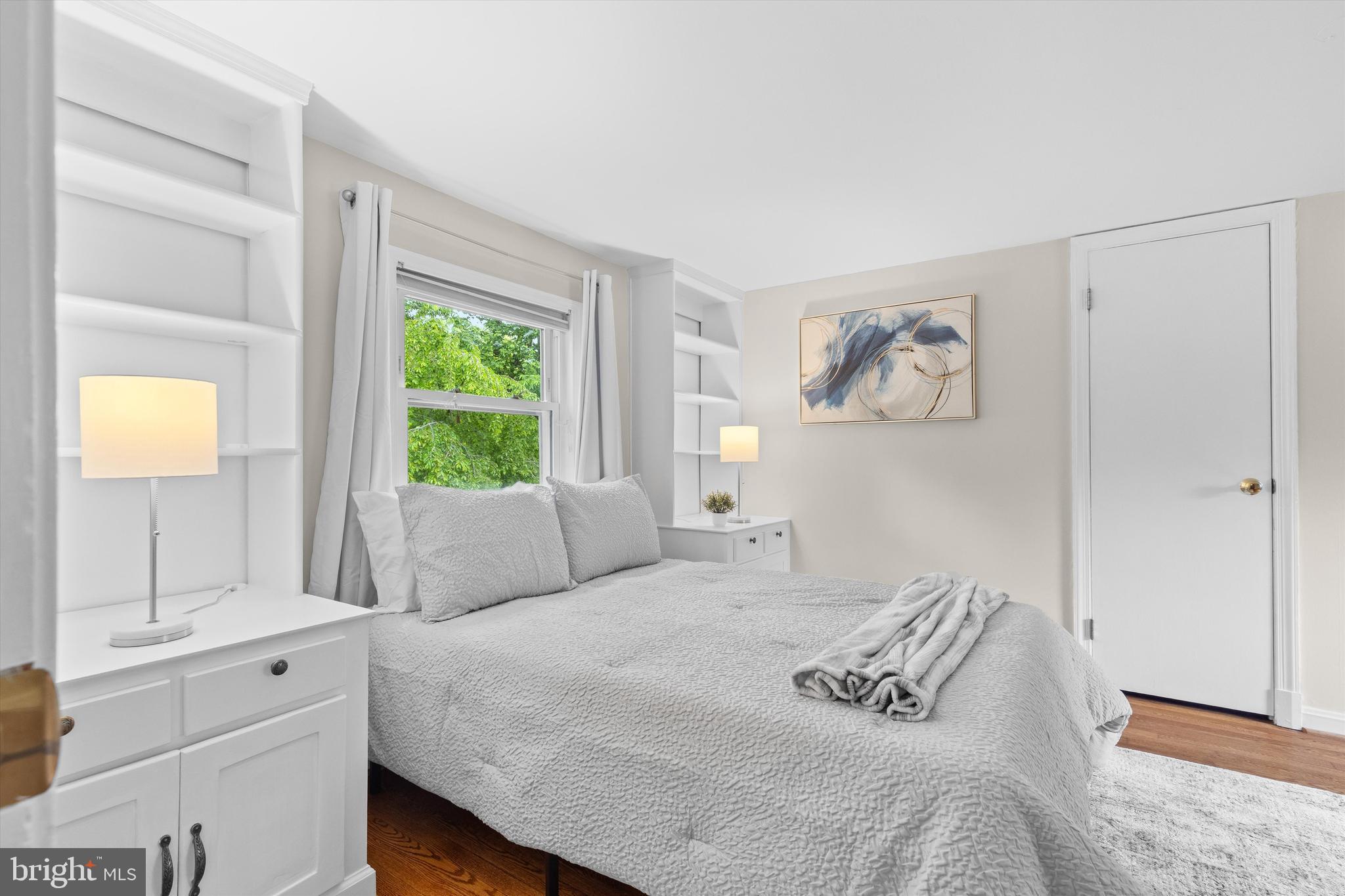 1918 Pagebrook Road Silver Spring, MD 20903 - Photo 14 of 24 a bedroom with a bed and a window