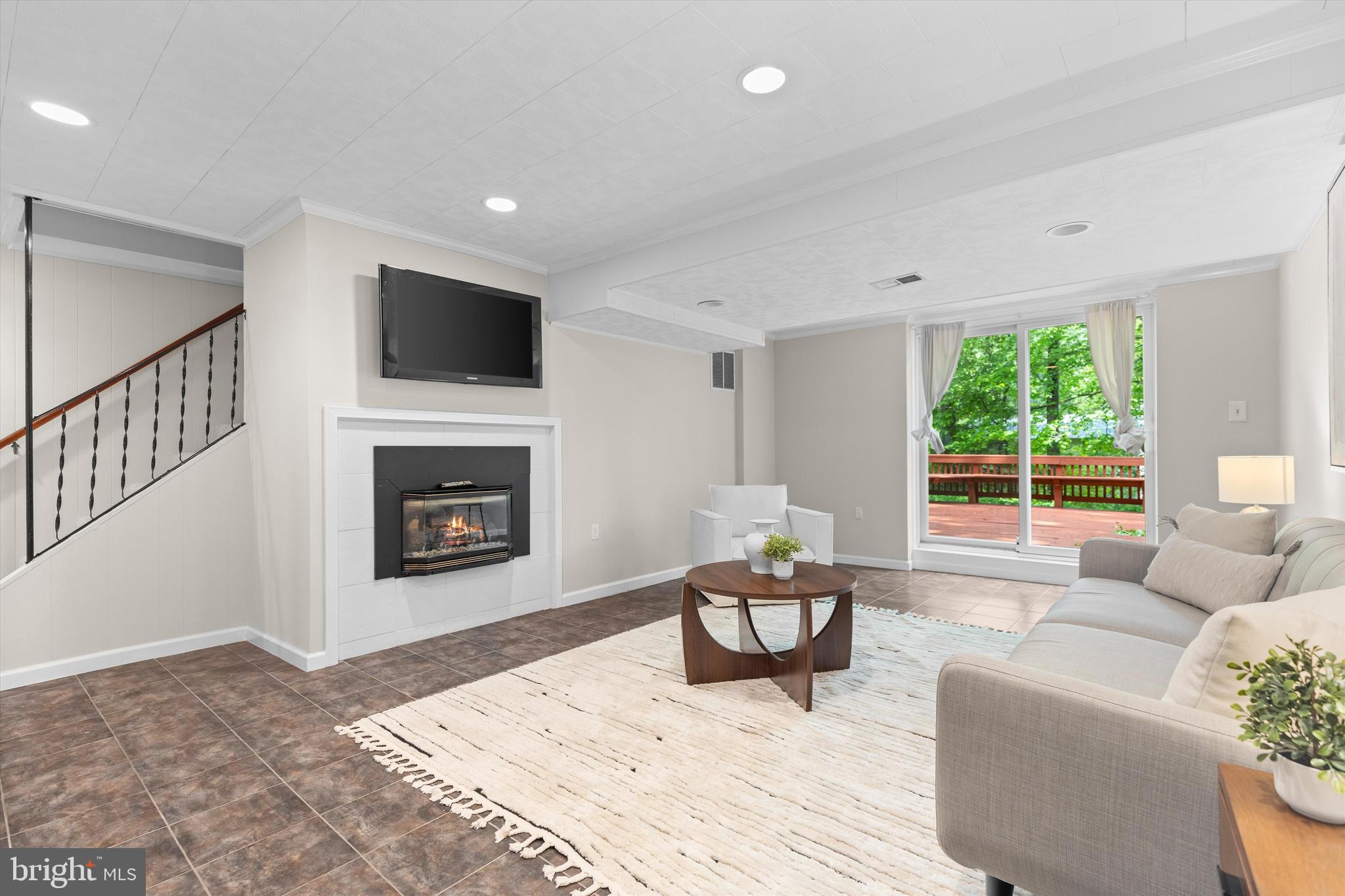 1918 Pagebrook Road Silver Spring, MD 20903 - Photo 19 of 24 a living room with furniture and a fireplace
