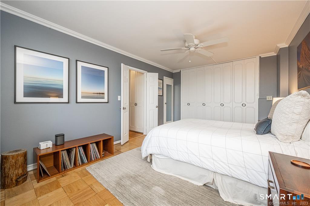 50 Glenbrook Road, Unit 6E Stamford, CT 06902 - Photo 14 of 18 a bedroom with a large bed and a chandelier