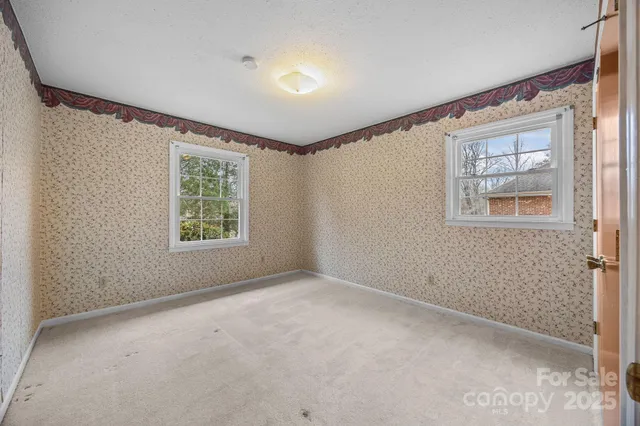 an empty room with windows