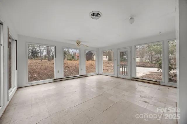 a view of an empty room with a sliding door