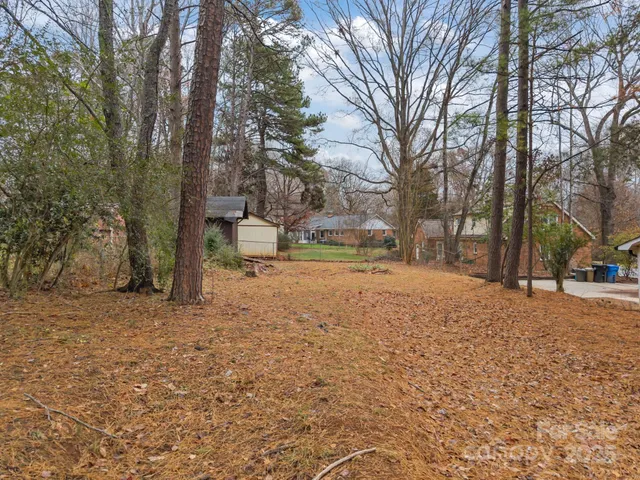 a house with trees covered with tall trees