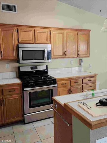 a kitchen with a stove and a microwave