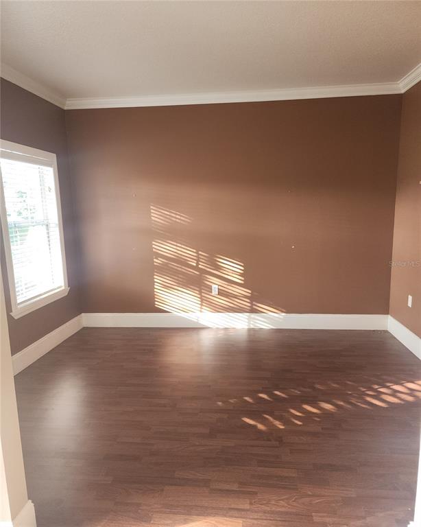 10969 Southwest 45th Avenue Ocala, FL 34476 - Photo 4 of 18 a view of empty room with wooden floor