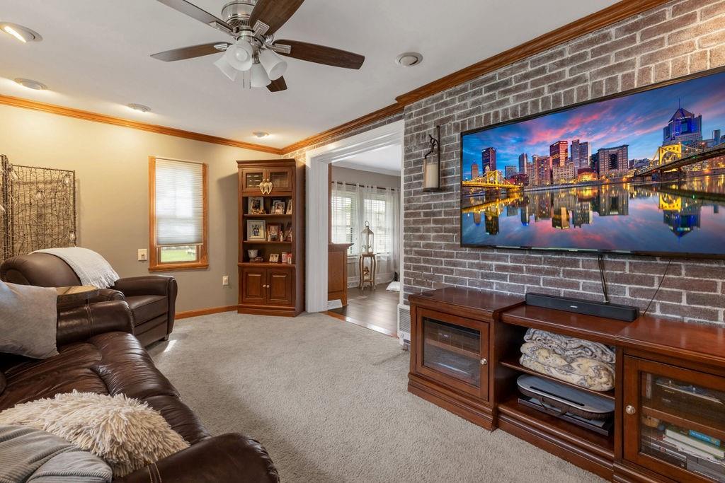 200 Orchard Street Beaver, PA 15009 - Photo 15 of 28 a living room with furniture and a flat screen tv