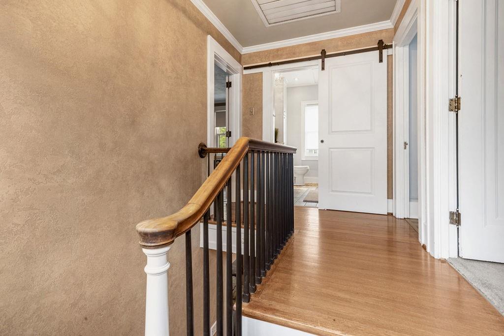 200 Orchard Street Beaver, PA 15009 - Photo 16 of 28 a view of a hallway with wooden floor and staircase